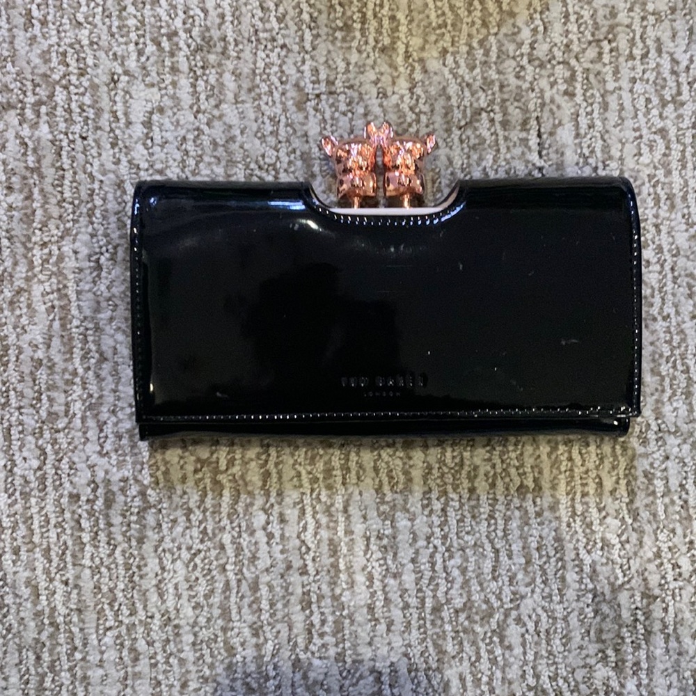 Black wallet with French bulldog clip and rose gold details